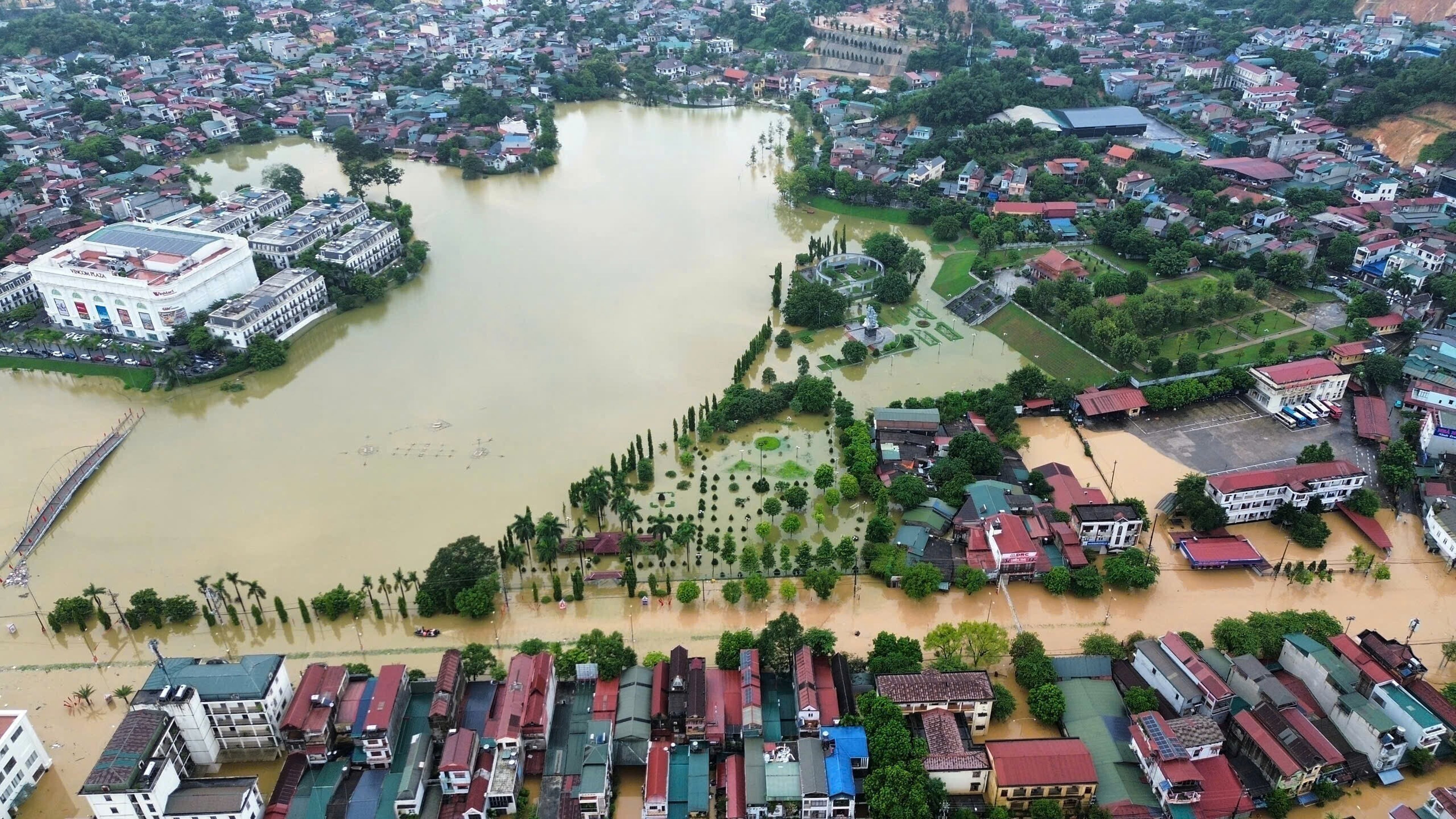 This aerial image shows flooding caused by rain following typhoon Bualoi in Lao Cai, Vietnam, Tuesday, Sept. 30, 2025. (Do Tuan Anh/VNA via AP)