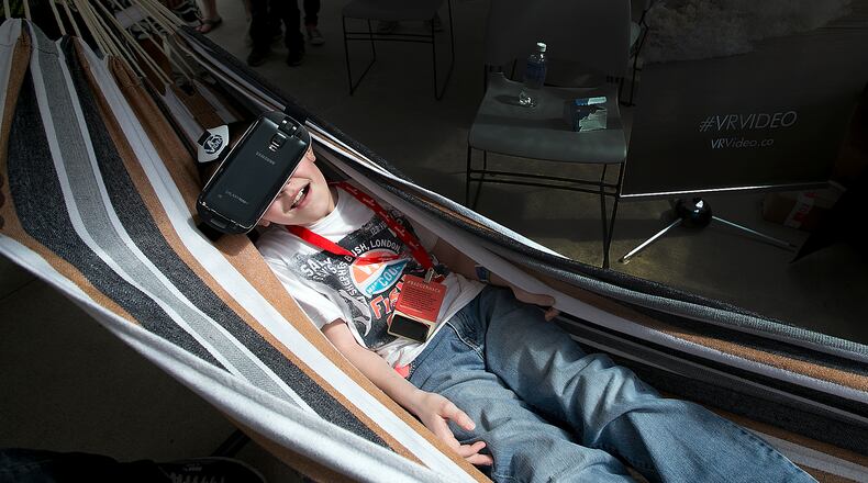 Draven Borchardt, 10, tries out a virtual reality tour of Costa Rica at the VR Video booth at Sx Create at the Long Center on Sunday, March 15, 2015. This free SXSW event highlighted new technology and science based activities. DEBORAH CANNON / AMERICAN-STATESMAN