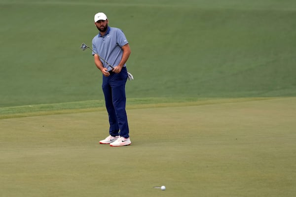 Scottie Scheffler reacts after missing a putt on the second hole during the second round at the Masters golf tournament, Friday, April 11, 2025, in Augusta, Ga. (AP Photo/Ashley Landis)