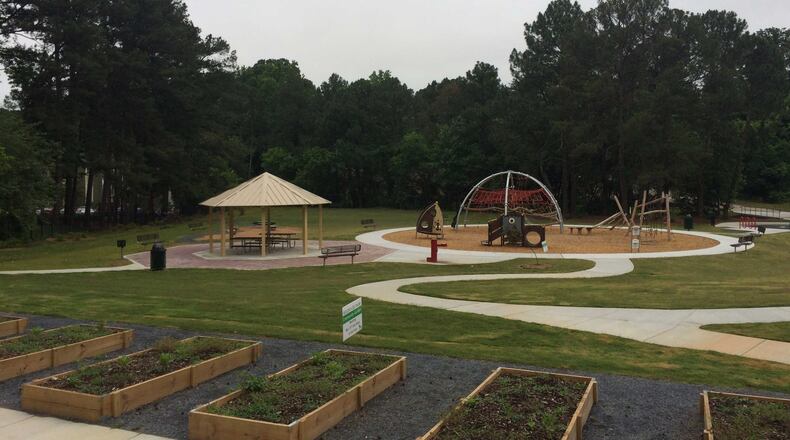 Brookside Park has a playground, pavilion, walking trails and a community garden. A dedication and ribbon cutting for the park are being held Saturday. MARK NIESSE / MARK.NIESSE@AJC.COM
