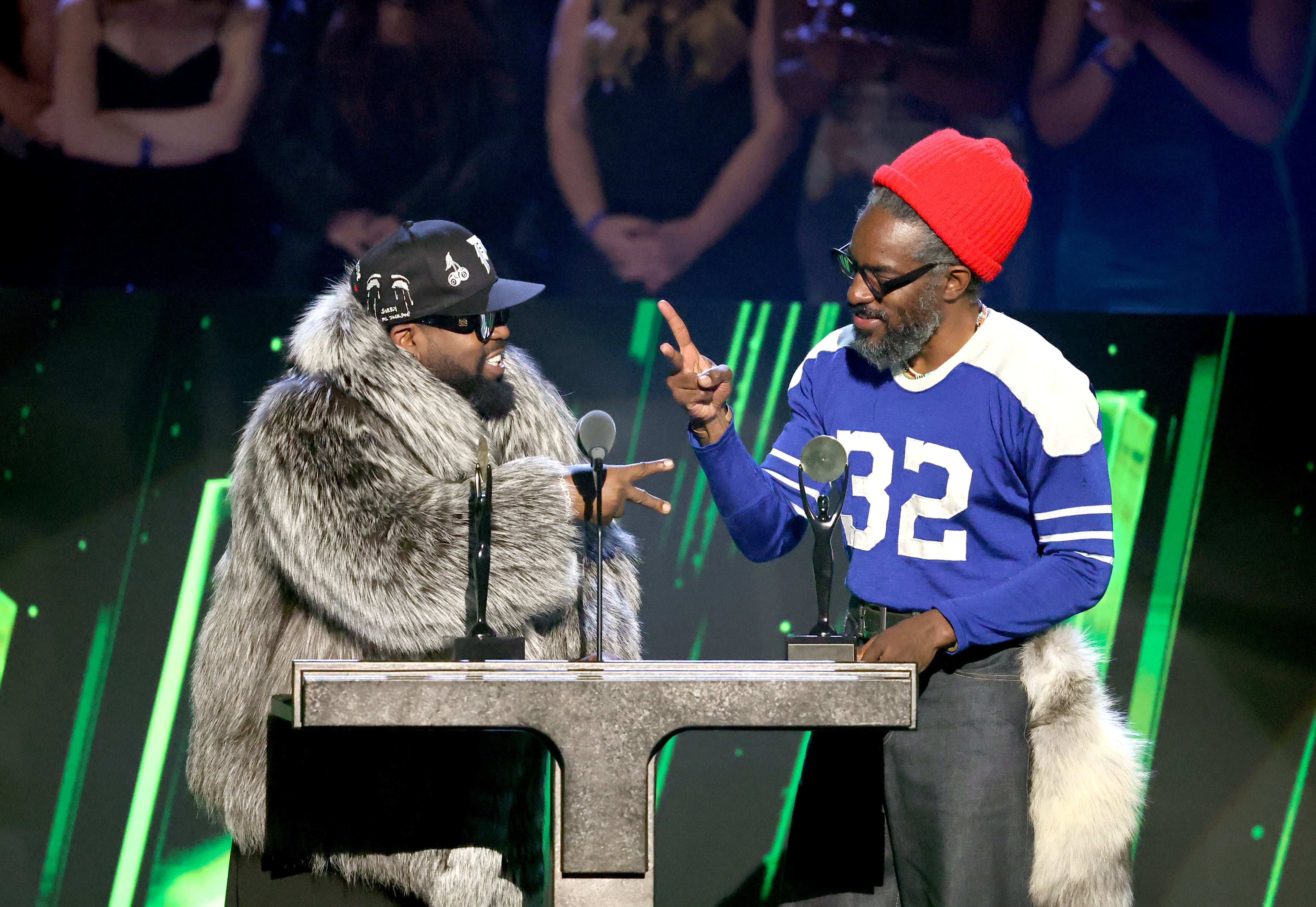Inductees Big Boi and André 3000 of OutKast play Rock Paper Scissors to determine who will speak first during the 2025 Rock & Roll Hall of Fame Induction Ceremony at Peacock Theater on November 08, 2025 in Los Angeles, California. (Photo by Amy Sussman/WireImage)