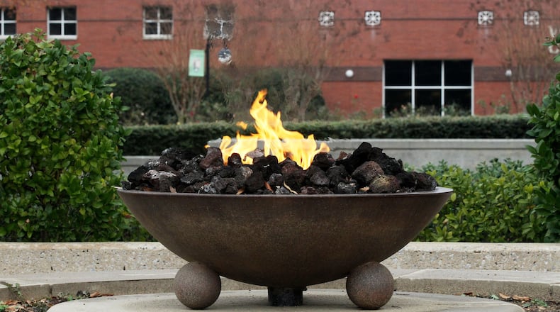 The Eternal Flame burns near the tomb of Martin Luther King Jr., overlooking the Martin Luther King Jr. National Historical Park. PHIL SKINNER / PSKINNER@AJC.COM