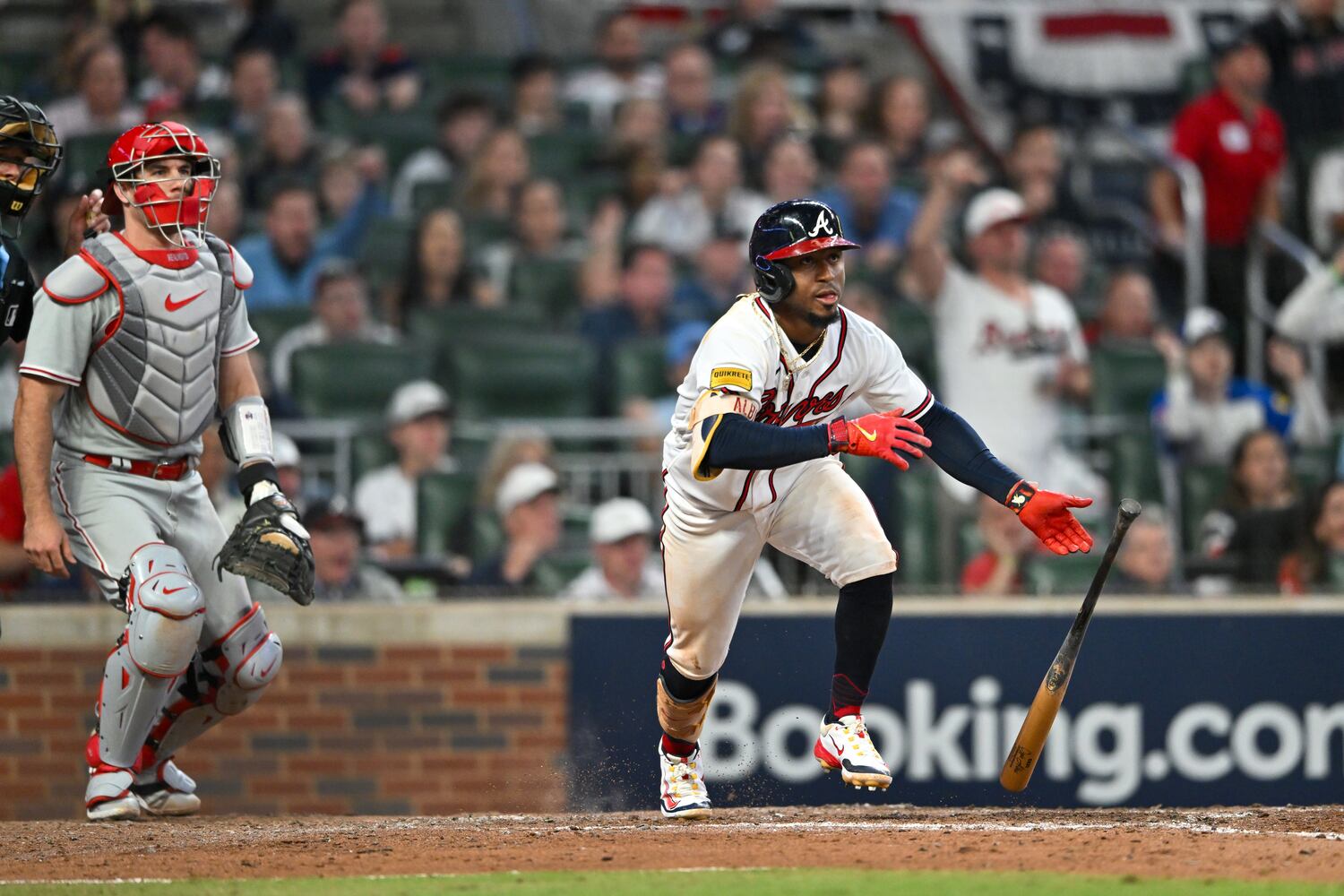 Atlanta Braves’ Ozzie Albies (1) singles against the Philadelphia Phillies before Ronald Acuna Jr. (13) scored on an error during the sixth inning of NLDS Game 2 in Atlanta on Monday, Oct. 9, 2023.   (Hyosub Shin / Hyosub.Shin@ajc.com)