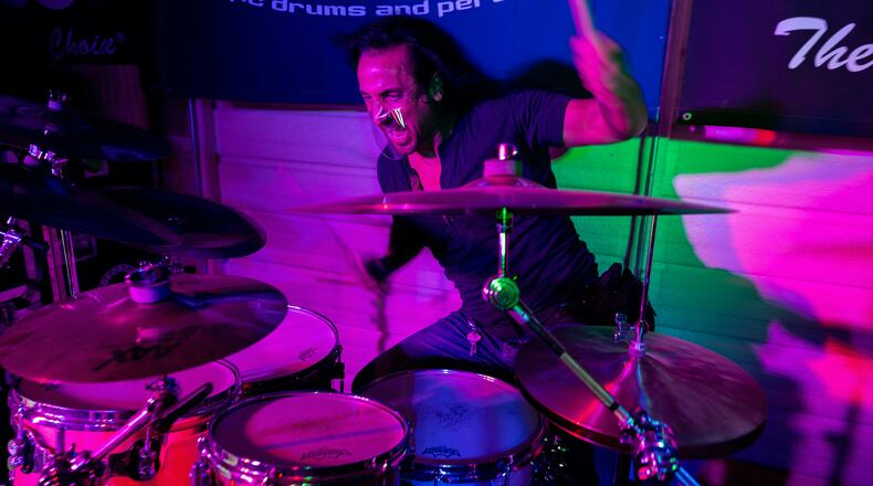 Daniel de los Reyes, percussionist for the Zac Brown Band, has created his own line of face shields and the company Mini-ShieldUSA. De los Reyes wants performers to be able to wear the face shields while playing to protect themselves on stage.