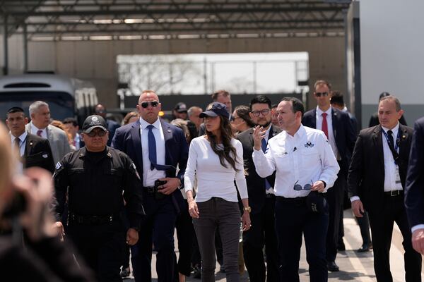 Minister of Justice and Public Security Héctor Villatoro, right center, accompanies Homeland Security Secretary Kristi Noem during a tour of the Terrorist Confinement Center in Tecoluca, El Salvador, Wednesday, March 26, 2025. (AP Photo/Alex Brandon)