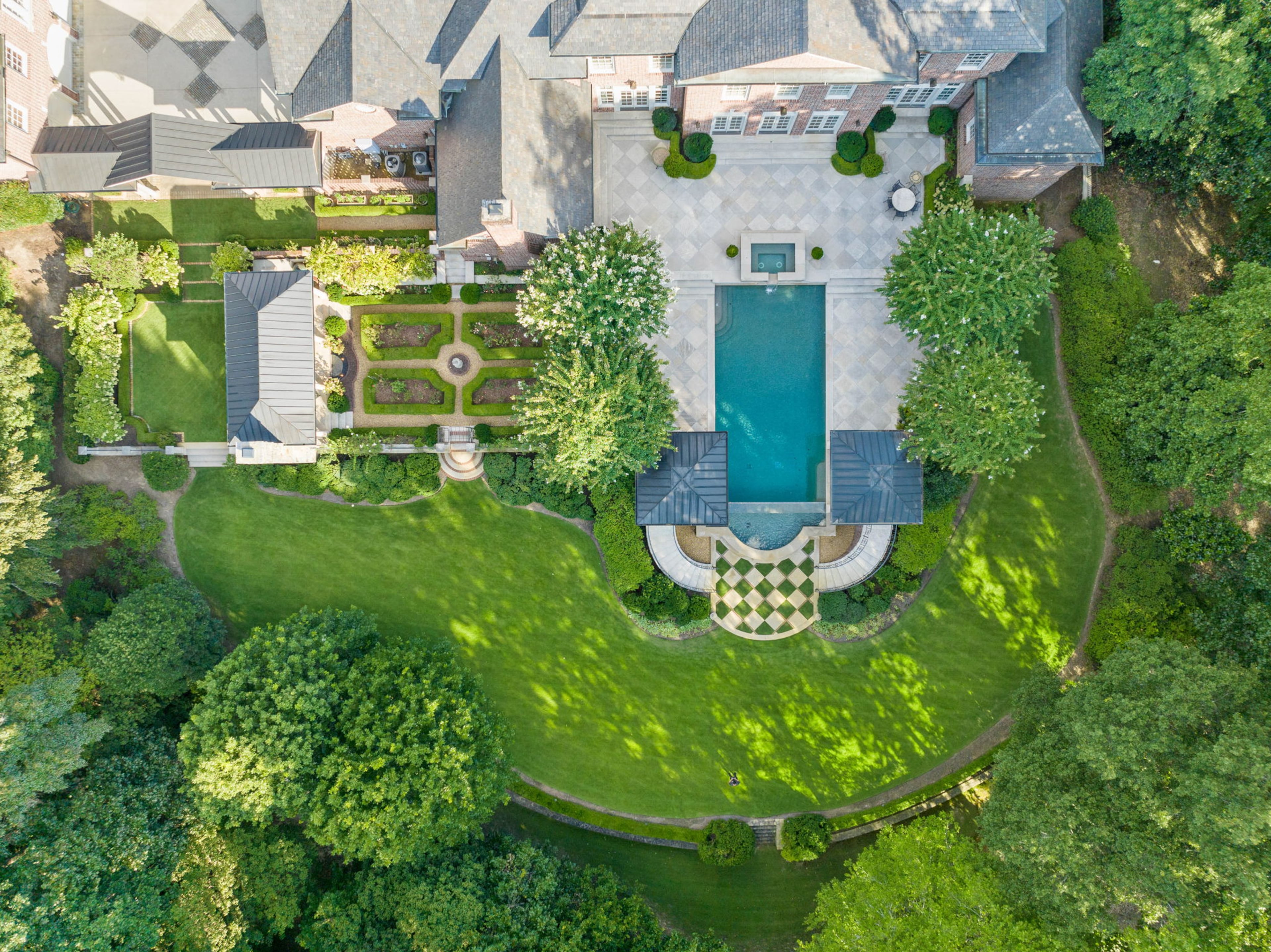 Sold for $12,865,000, the Buckhead property features over 14,000 square feet of living space in the main house alone.