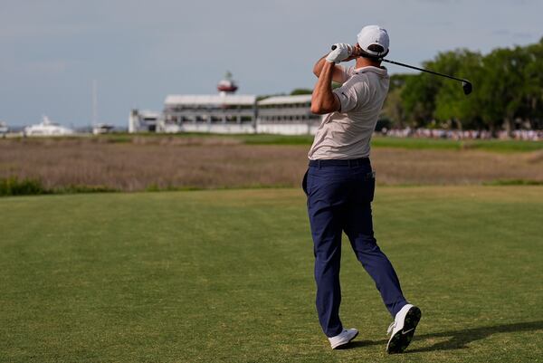 Scottie Scheffler watches his drive from the 18th tee during the final round of the RBC Heritage golf tournament, Sunday, April 20, 2025, in Hilton Head Island, S.C. (AP Photo/Mike Stewart)