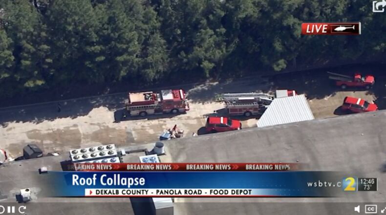 Officials said the woman became trapped when a roof collapsed and fell on her.