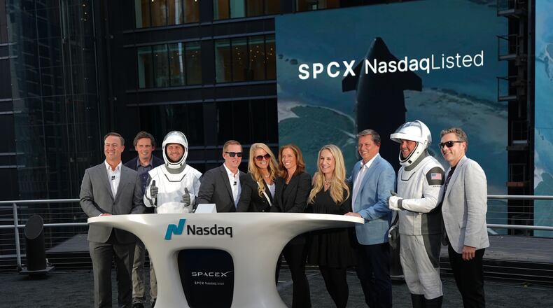 SpaceX executives pose during a closing bell ceremony for the IPO of SpaceX at the Nasdaq MarketSite in New York, Friday, June 12, 2026, in New York. (AP Photo/Frank Franklin II)