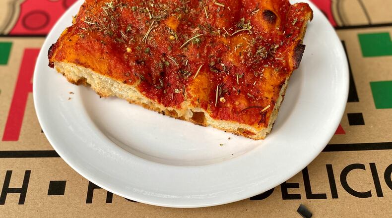 This is a slice of Ladrillo — aka grandma pie — from La Calavera Pizza. Ladrillo is the Spanish word for brick, and these heavy, red, rectangular slices do look a bit like red bricks. Wendell Brock for The Atlanta Journal-Constitution