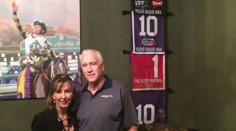 Dean and Patti Reeves at home, with a few reminders of some good days at the races.