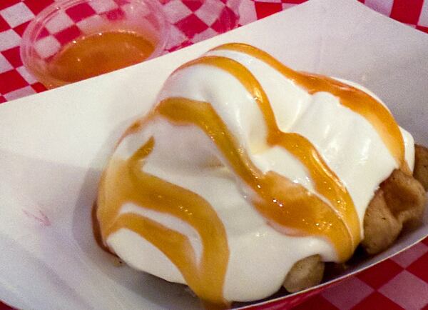 A Liege waffle with vanilla custard and caramel sauce at NFA Burger in Alpharetta's Avalon. (Henri Hollis/AJC)