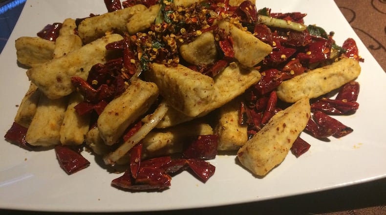 The dry-fried eggplant at Yummy Spicy is a nice introduction to Sichuan cooking. CONTRIBUTED BY WENDELL BROCK