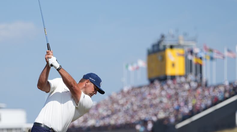 Bryson DeChambeau of the United States plays tom the 18th green from the rough during the first day of the British Open Golf championships at Royal Birkdale golf club, in Southport, England, Thursday, July 16, 2026. (AP Photo/Jon Super)