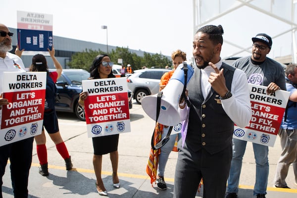 A Delta flight attendant speaks during a pro-union flight attendants rally on Thursday, March 25, 2023, at Hartsfield-Jackson Atlanta International Airport. The Association of Flight Attendants has been working to unionize Delta's nearly 30,000 flight attendants for decades. (Christina Matacotta for the AJC)