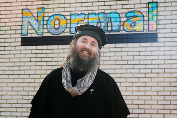 Athens-based artist Noah James Saunders standing outside his favorite bar, Normal, in his Athens neighborhood of Normaltown. (Courtesy of Rouse Photography)