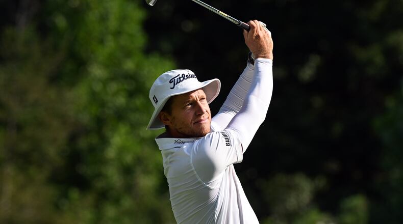 Peter Malnati hits from the 11th tee during the first round of the Rocket Classic golf tournament at the Detroit Golf Club, Thursday, July 30, 2026, in Detroit. (AP Photo/Jose Juarez)