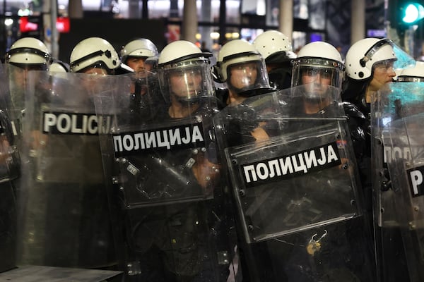 Riot police take positions on a street during a major anti-government rally pressing for an early election after nearly eight months of almost daily anti-corruption demonstrations that have shaken the populist government of President Aleksandar Vucic, in Belgrade, Serbia, Saturday, June 28, 2025. (AP Photo/Marko Drobnjakovic)