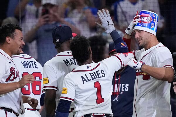 Bucket-headed first baseman Matt Olson celebrates his Wednesday walk-off. (Brynn Anderson/AP)