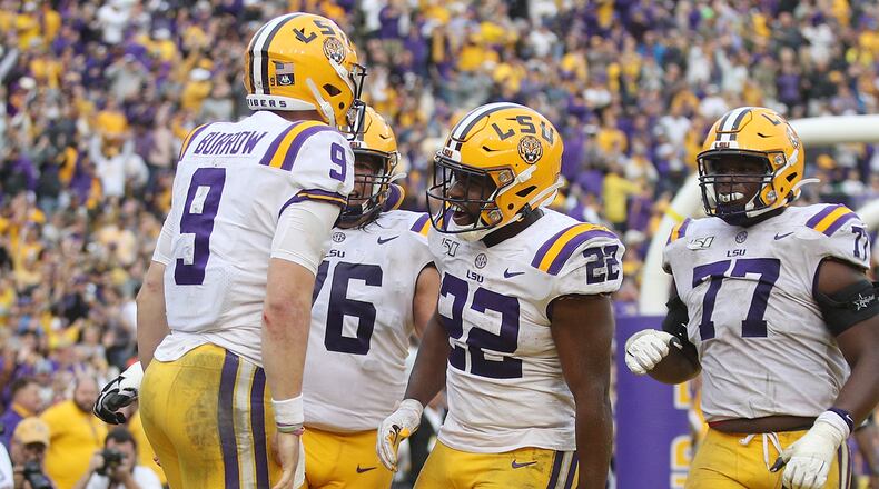 Joe Burrow #9 of the LSU Tigers celebrates with teammates after rushing for a touchdown against the Auburn Tigers during the second half at Tiger Stadium on October 26, 2019 in Baton Rouge, Louisiana. (Photo by Chris Graythen/Getty Images)