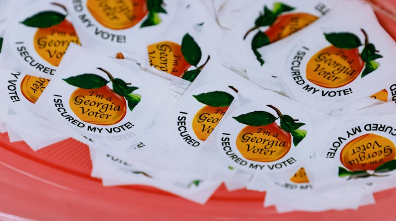 Georgia voter stickers are shown at the Roswell Library on Friday, May 20, 2022. (Natrice Miller/AJC)