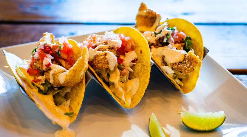 The Tomahawk Tacos at Catfish Hox were named best seafood dish at Taste of Marietta for two years in a row. CONTRIBUTED BY HENRI HOLLIS