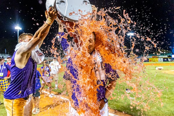 LSU Shreveport head coach Brad Neffendorf is doused by his players after defeating Southeastern of Florida to win the championship game of the NAIA World Series college baseball game, Friday, May 30 2025, at Harris Field in Lewiston, Idaho. (August Frank/Lewiston Tribune via AP)