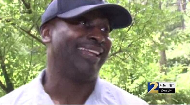 Postal worker Mark Palmer returns to the DeKalb County home where he saved the life of a 79-year-old woman who fell down her front steps.