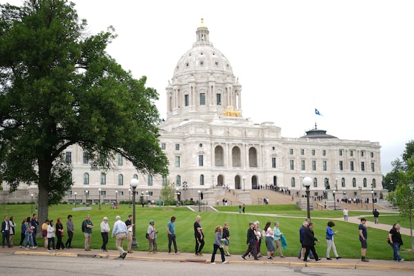 People wait in line to pay their respects to Minnesota state Rep. Melissa Hortman, her husband, Mark Hortman and their dog, Gilbert, at the Minnesota State Capitol in St. Paul, Minn., on Friday, June 27, 2025. (Alex Kormann/Star Tribune via AP)