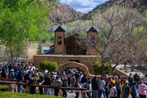 Thousands of pilgrims make their way to El Santuario De Chimayo in Northern New Mexico on Good Friday, April 18, 2025 in Chimayo, N.M. (AP Photo/Roberto E. Rosales)