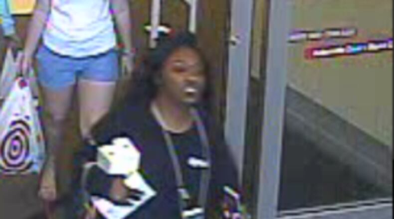 Police say this woman pretended to be a Target employee and stole more than $11,000 worth of iPhones in DeKalb County.