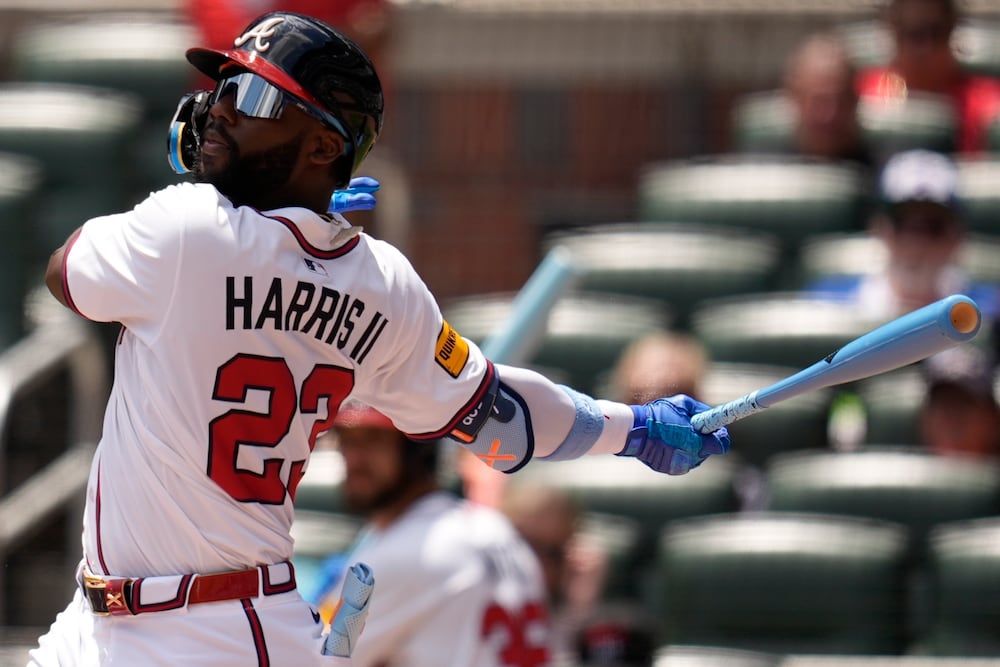 Braves center fielder Michael Harris II hits a single during Sunday's game against the Rockies.