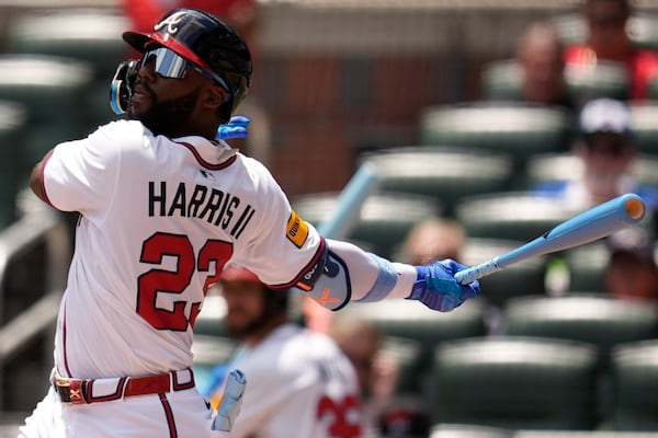 Braves center fielder Michael Harris II hits a single during Sunday's game against the Rockies.