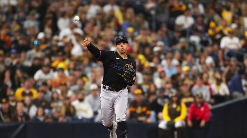 Miami Marlins third baseman Joe Dunand throws to first base during a baseball game against the San Diego Padres, Saturday, May 7, 2022, in San Diego. (AP Photo/Derrick Tuskan)
