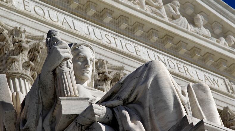 A detail of the West Facade of the U.S. Supreme Court is seen in Washington, Monday, March 7, 2011. The court is taking up a climate change case for the second time in four years. On Tuesday, April 19, the court will hear arguments in the case American Electric Power Co. v. Connecticut, 10-174. The Obama administration is siding with American Electric Power Co. and three other companies in urging the high court to throw out the lawsuit on grounds the Environmental Protection Agency, not a federal court, is the proper authority to make rules about climate change. (AP Photo/J. Scott Applewhite, File)