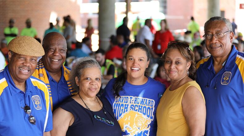 Atlanta Public Schools Superintendent Meria Carstarphen, center, poses for a photograph with members of the David T. Howard High School Alumni Association during a "topping out" ceremony on Friday, Aug. 23, 2019. Bill Goodman/Atlanta Public Schools
