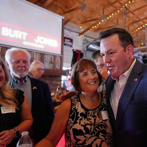 Georgia gubernatorial candidate Burt Jones meets with supporters during a primary election night watch party, Tuesday, May 19, 2026, in Jackson, Ga. (AP Photo/Mike Stewart)
