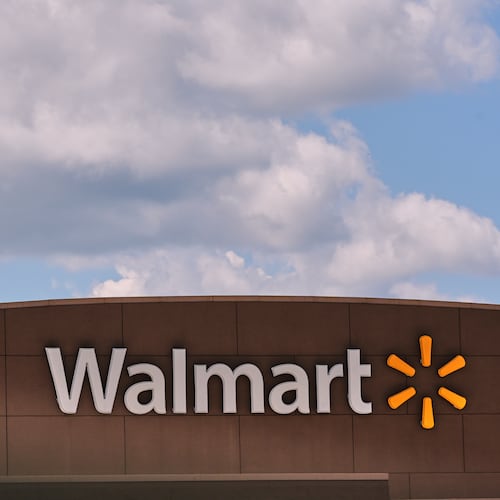 FILE - Clouds pass over the Walmart store, Thursday, Aug. 14, 2025, in Manchester, N.H. (AP Photo/Charles Krupa, File)