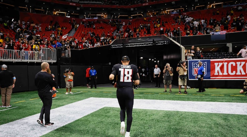 Atlanta Falcons quarterback Kirk Cousins (18) leaves the field after the game on Sunday, Sept. 8, at Mercedes-Benz Stadium in Atlanta. The Falcons lost 18-10
(Miguel Martinez/ AJC)