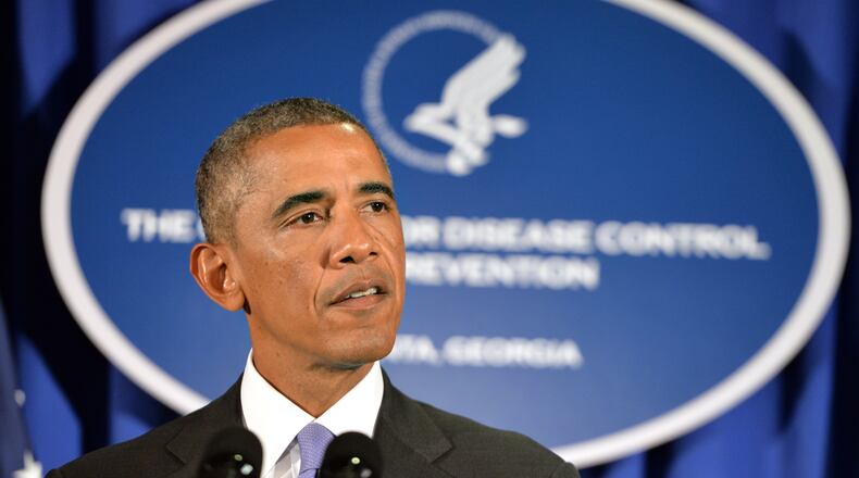 September 16, 2014 Atlanta - President Barack Obama delivers remarks at the Centers for Disease Control and Prevention in Atlanta on Tuesday, September, 16, 2014. President Barack Obama visits the Centers for Disease Control and Prevention to receive a briefing on the outbreak of the Ebola virus in West Africa, discuss the U.S. response, and thank the scientists, doctors, and health care workers who are helping those affected by disease at home and around the world. HYOSUB SHIN / HSHIN@AJC.COM President Obama spoke at the Centers for Disease Control and Prevention about the Ebola crisis last September. The president is returning to Atlanta on Tuesday to discuss college affordability. (AJC FILE PHOTO)