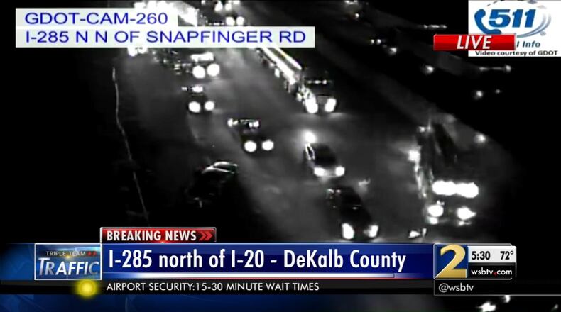 A rollover injury crash blocked lanes of I-285 North near I-20 Monday. (Credit: Channel 2 Action News)