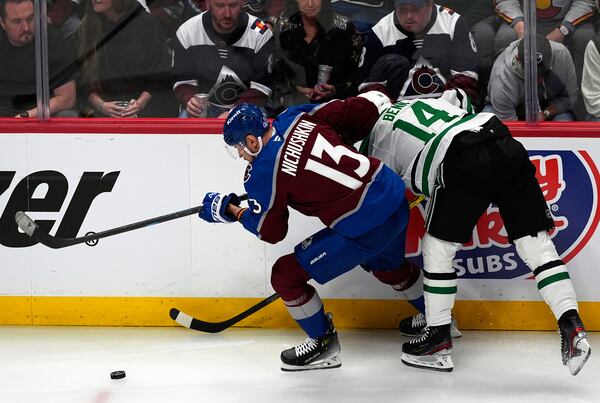 Colorado Avalanche right wing Valeri Nichushkin, right, drives past Dallas Stars left wing Jamie Benn in the first period of Game 3 of an NHL hockey first-round playoff series Wednesday, April 23, 2025, in Denver. (AP Photo/David Zalubowski)
