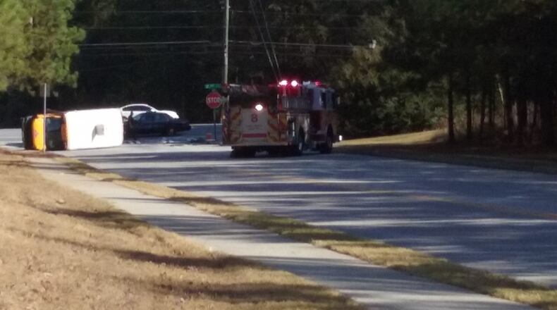 A day care bus overturned Friday in Rockdale County. (Credit: Channel 2 Action News)