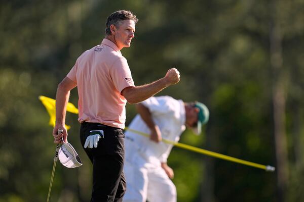 Justin Rose celebrates after a birdie on the 18th hole during the final round at the Masters golf tournament, Sunday, April 13, 2025, in Augusta, Ga. (AP Photo/David J. Phillip)