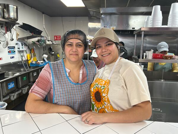Veronica Martinez (left) poses with her daughter Brenda Martinez at their Marietta restaurant Cocina de la Tia. (Olivia Wakim/AJC)