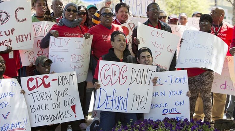Nearly 100 AID Atlanta supporters turned out Friday to demand an answer from the Centers of Disease Control and Prevention about why the agency denied funding to the nonprofit. CONTRIBUTED