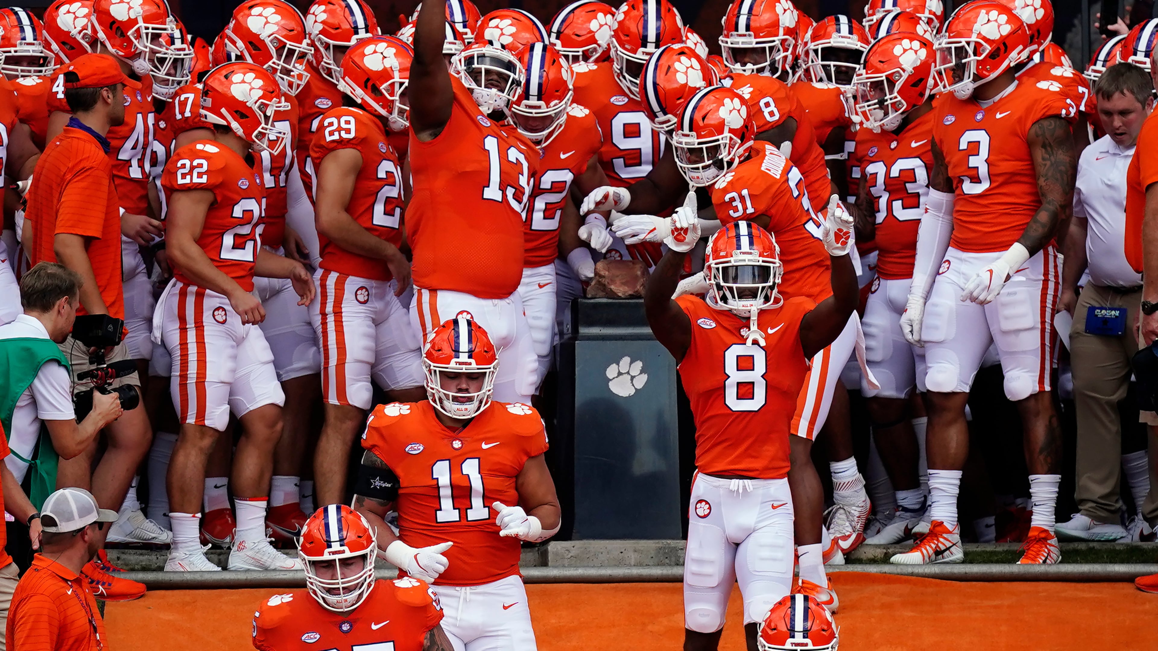 FILE - Clemson players touch Howard's Rock as they run onto the field for an NCAA college football game against Georgia Tech Saturday, Sept. 18, 2021, in Clemson, S.C. (AP Photo/John Bazemore, File)
