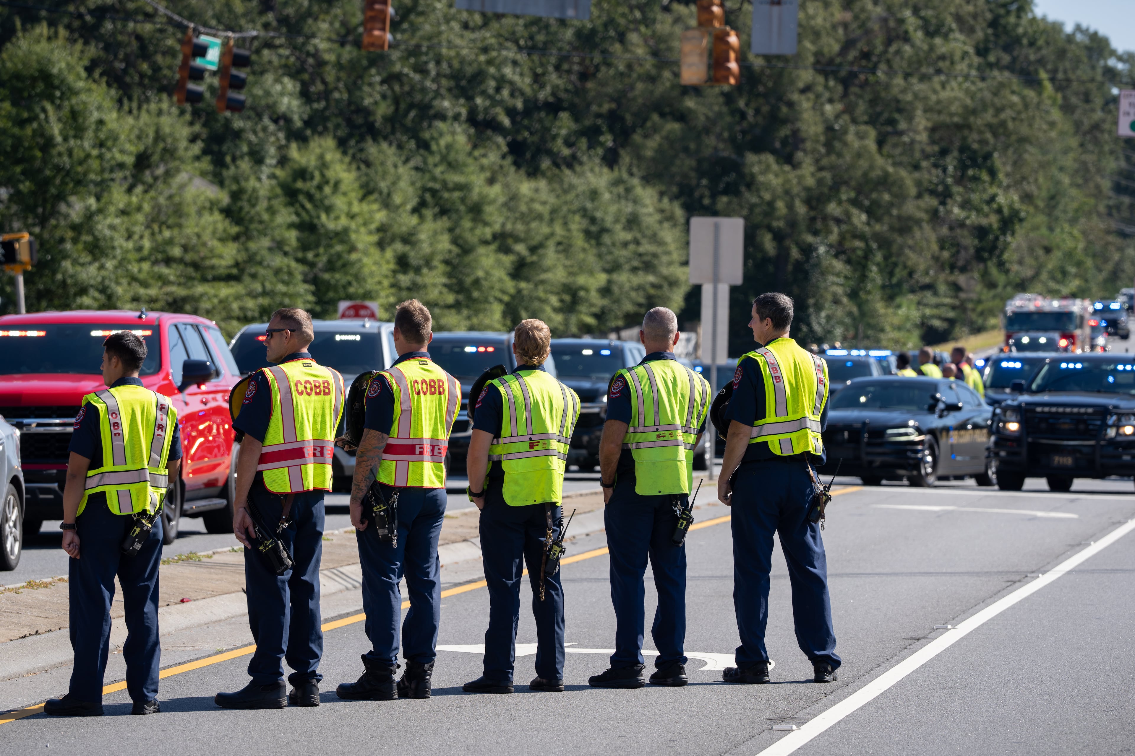 Cobb County firefighters stand together as they honor fallen Dekalb County Firefighter Preston Fant as a procession in his honor arrives at the West Cobb Funeral Home on Wednesday, Sept. 10, 2025. (Ben Hendren for the AJC)