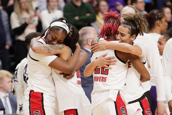 North Carolina State players react after their loss to LSU in the Sweet 16 of the NCAA college basketball tournament, Friday, March 28, 2025, in Spokane, Wash. (AP Photo/Young Kwak)