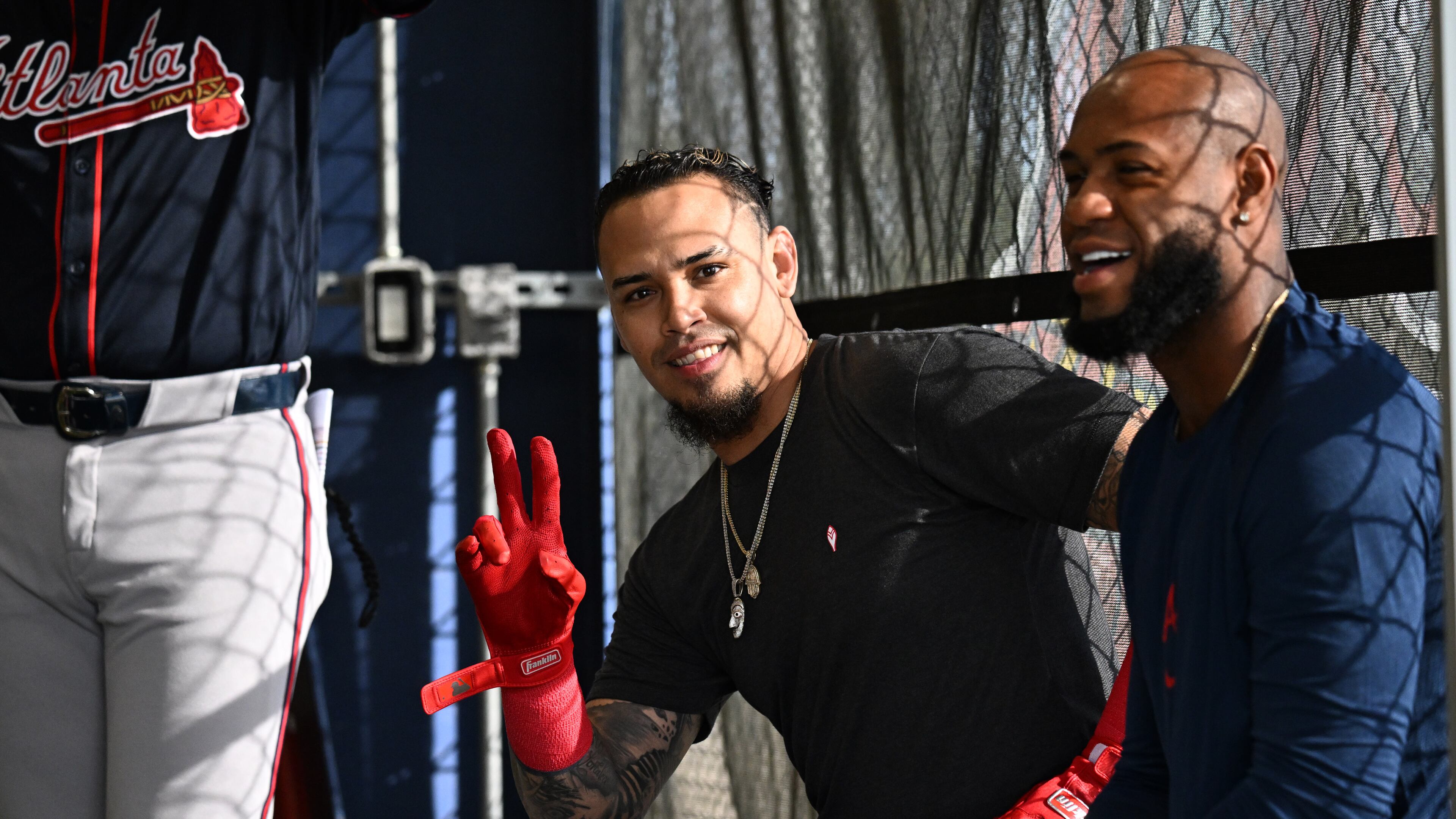 Braves shortstop Orlando Arcia (center), who was released by the team Sunday, said “I think I’m always going to try to be the same person, regardless of whether I’m playing or not.” (Hyosub Shin/AJC)